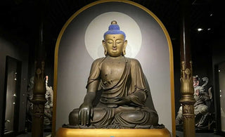 A Point of Focus for Meditation and Contemplation: The Eight Auspicious Symbols Placed on Lotus Pedestals in Front of Statues of the Buddha