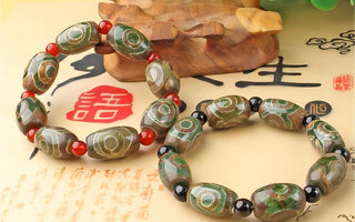 Sacred Symbols: Exploring Tibetan Bracelets with Three-Eyed Dzi Beads