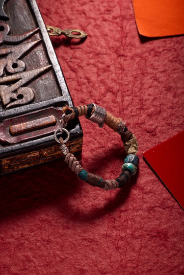 Himalayan Spirit Bracelet – Turquoise & Cotton with Silver Charm